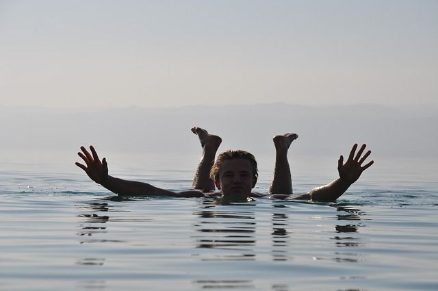 Swimmer floating on the Dead Sea