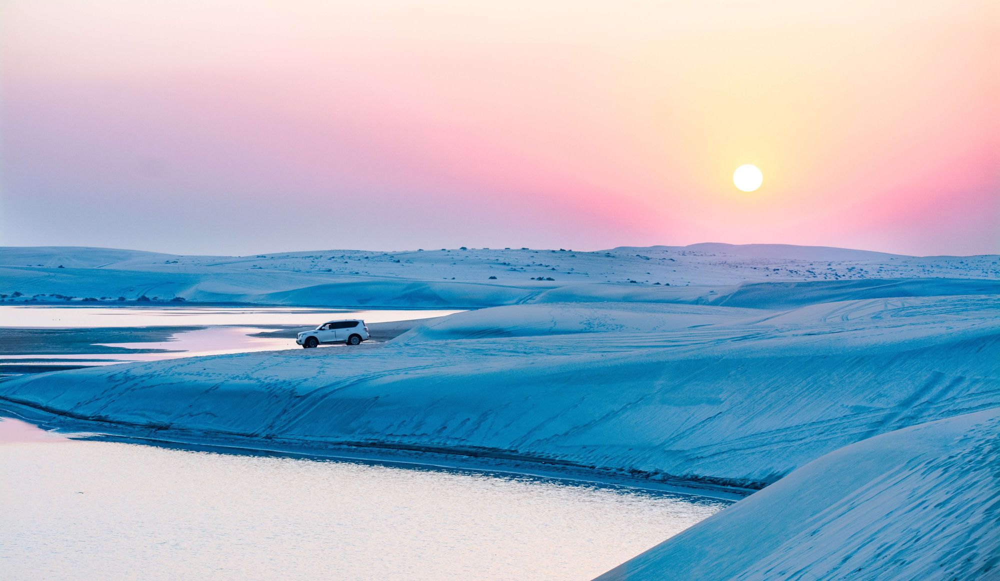 Dunes running into the sea